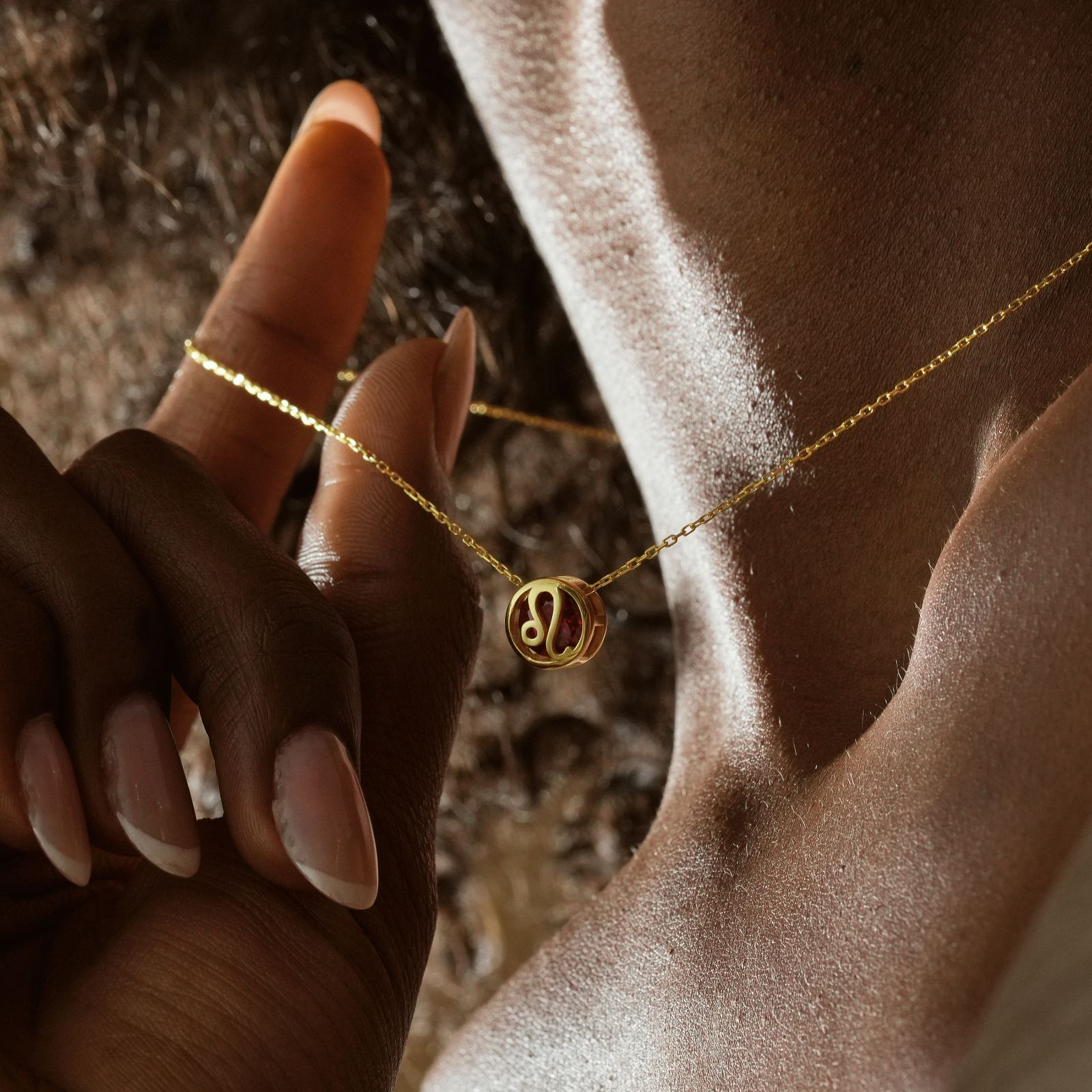 Zodiac Constellation Necklace featuring a delicate gold pendant on a model's neck, showcasing astrology design.