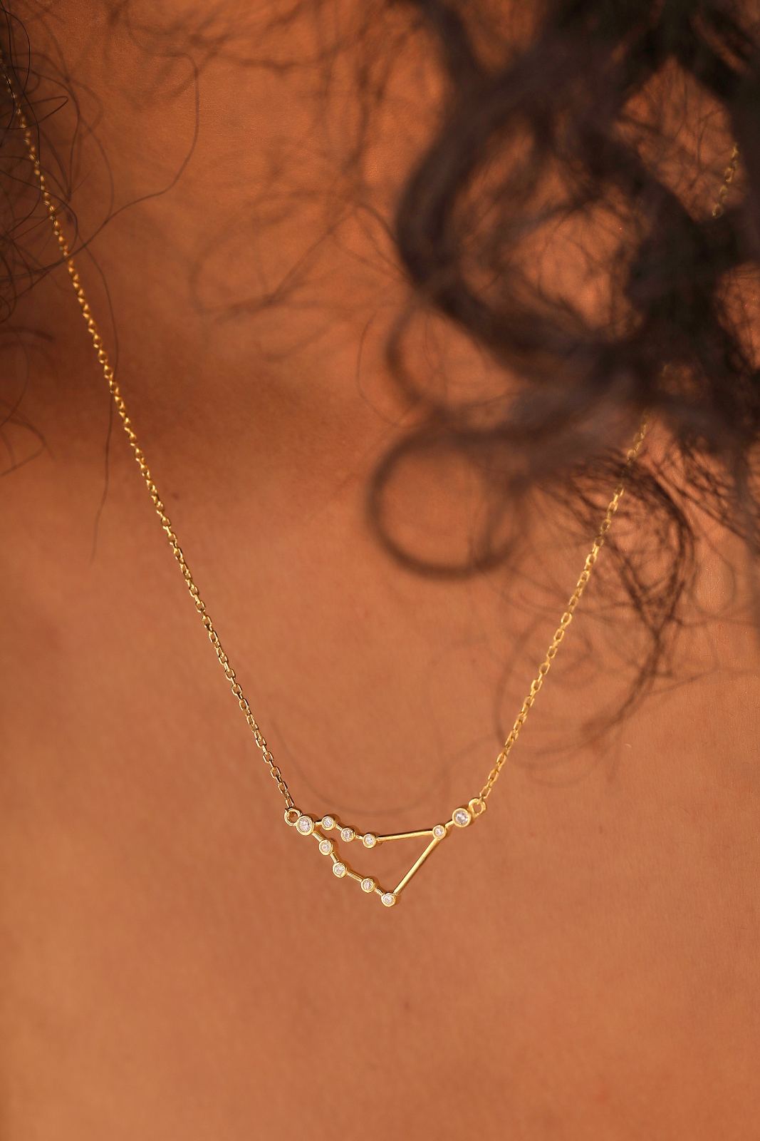 Zodiac Constellation Necklace Sterling Silver elegantly worn, showcasing the delicate constellation design and gold vermeil finish.